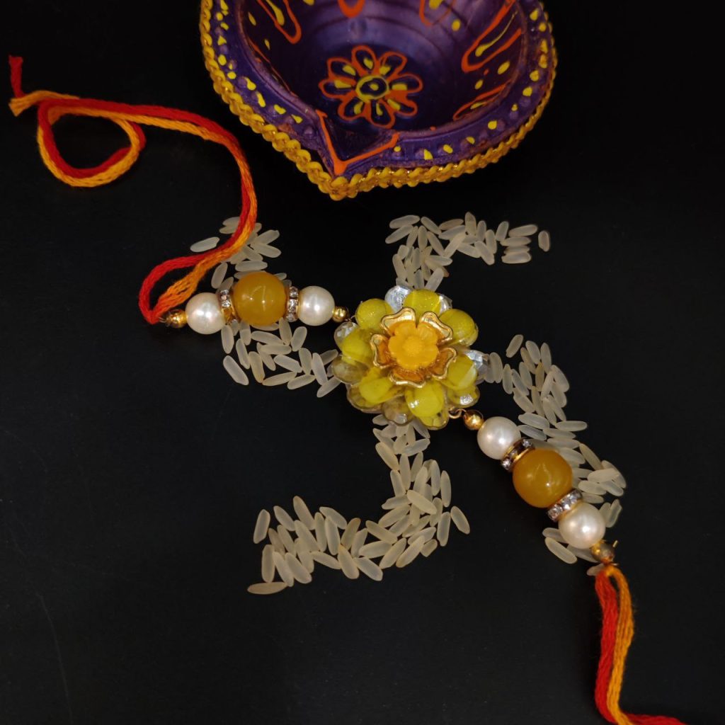 Kundan Bhaiya Rakhi Yellow Flower Charms