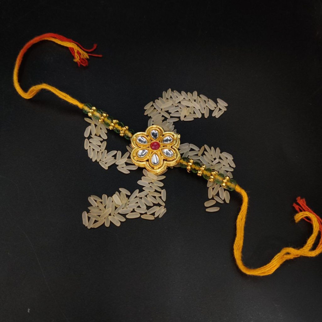 Blessed Knot: Divine Rakhi for Brother's Prosperity