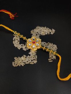 Blessed Knot: Divine Rakhi for Brother's Prosperity