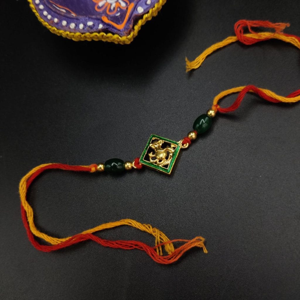 Elegant Kundan Meena Work Rakhi with Sparkling Stones