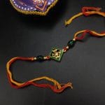 Elegant Kundan Meena Work Rakhi with Sparkling Stones