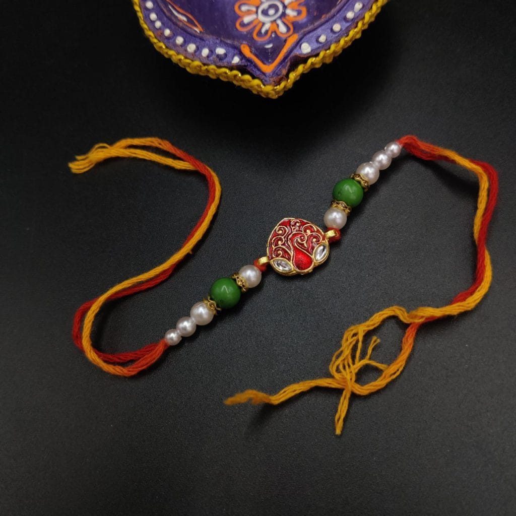 Delicate Kundan Meena Work Rakhi with Timeless Beauty
