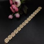 Graceful and ornate gold plated Shish Patti headpiece with filigree and stones