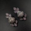 Silver flower pot earrings inspired by Kalash culture, crafted with intricate silver detailing.