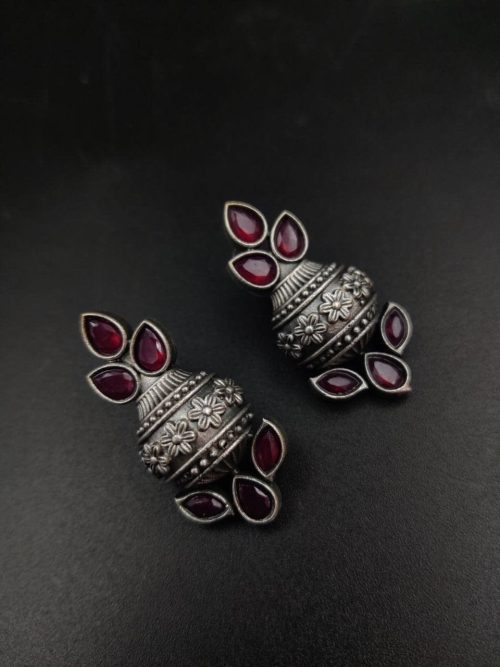 Silver flower pot earrings inspired by Kalash culture, crafted with intricate silver detailing.