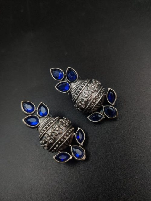 Silver flower pot earrings inspired by Kalash culture, crafted with intricate silver detailing.