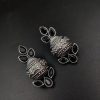 Silver flower pot earrings inspired by Kalash culture, crafted with intricate silver detailing.