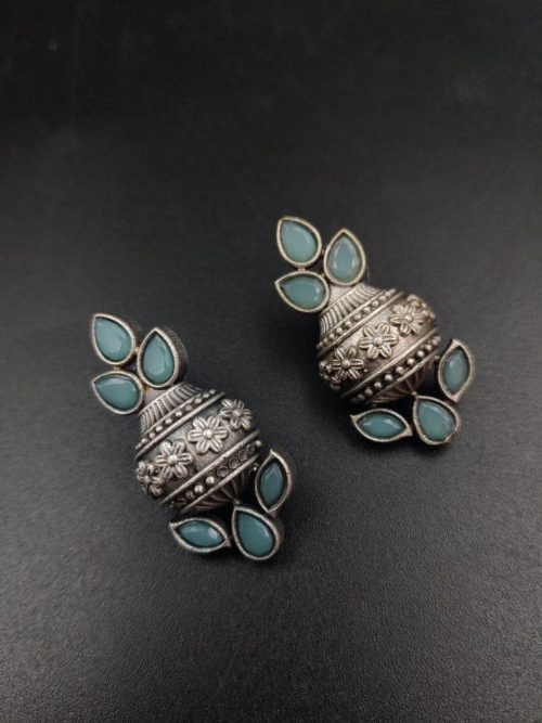 Silver flower pot earrings inspired by Kalash culture, crafted with intricate silver detailing.