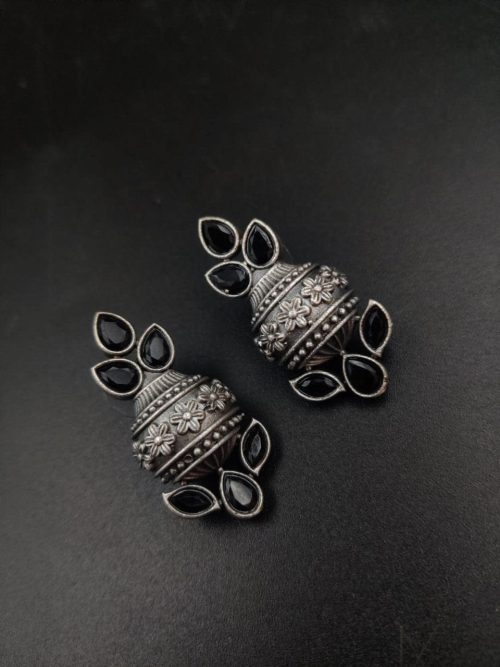 Silver flower pot earrings inspired by Kalash culture, crafted with intricate silver detailing.