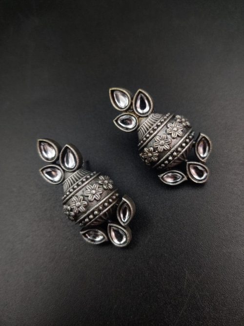 Silver flower pot earrings inspired by Kalash culture, crafted with intricate silver detailing.