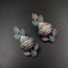Silver flower pot earrings inspired by Kalash culture, crafted with intricate silver detailing.