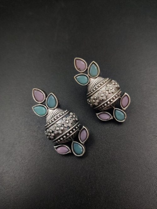 Silver flower pot earrings inspired by Kalash culture, crafted with intricate silver detailing.