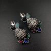 Silver flower pot earrings inspired by Kalash culture, crafted with intricate silver detailing.