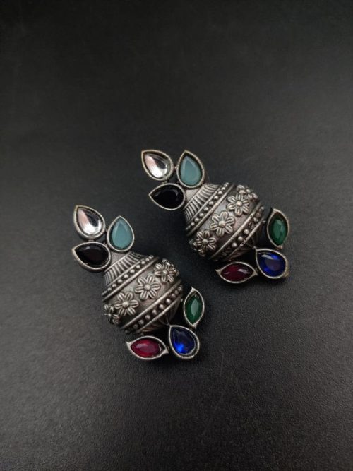 Silver flower pot earrings inspired by Kalash culture, crafted with intricate silver detailing.