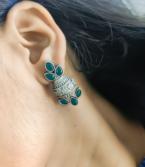 Silver flower pot earrings inspired by Kalash culture, crafted with intricate silver detailing.