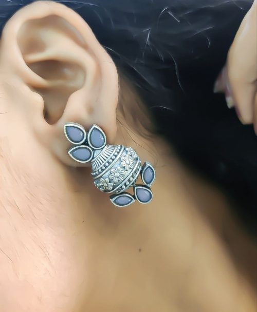 Silver flower pot earrings inspired by Kalash culture, crafted with intricate silver detailing.