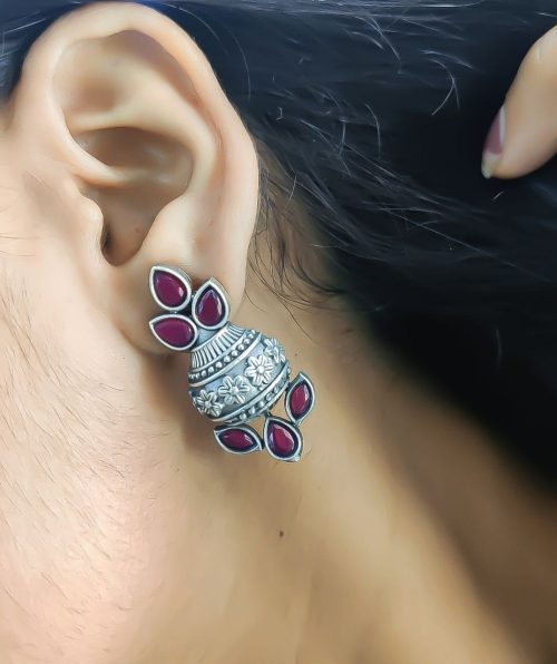 Silver flower pot earrings inspired by Kalash culture, crafted with intricate silver detailing.