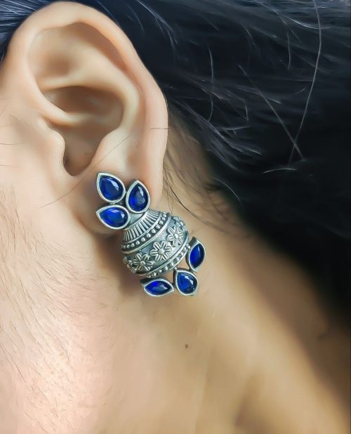Silver flower pot earrings inspired by Kalash culture, crafted with intricate silver detailing.