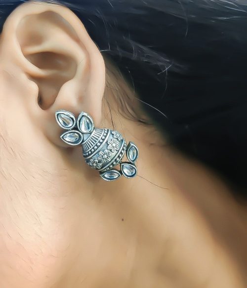 Silver flower pot earrings inspired by Kalash culture, crafted with intricate silver detailing.