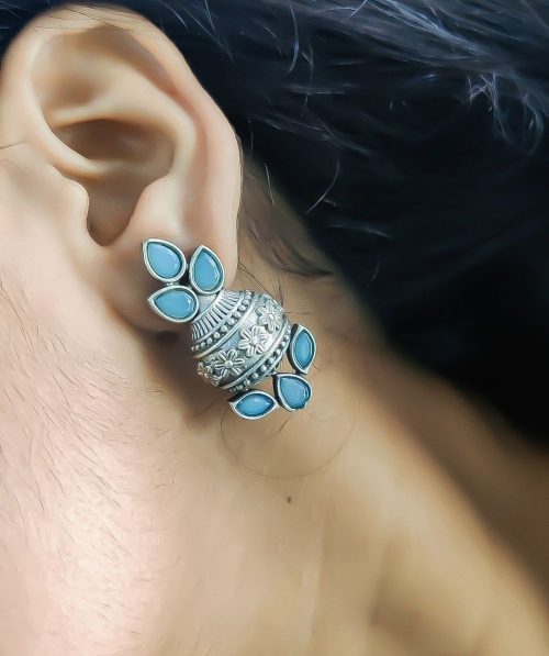 Silver flower pot earrings inspired by Kalash culture, crafted with intricate silver detailing.