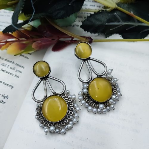 Hand-made silver earrings featuring a stone resembling the Monalisa Stone