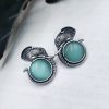 Silver replica elephant design earrings with Monalisa stone studs, perfect for casual wear
