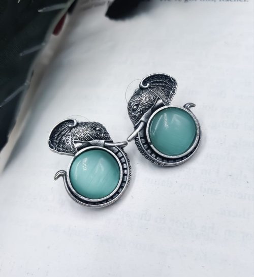 Silver replica elephant design earrings with Monalisa stone studs, perfect for casual wear