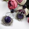 Hand-made silver earrings featuring a stone resembling the Monalisa Stone