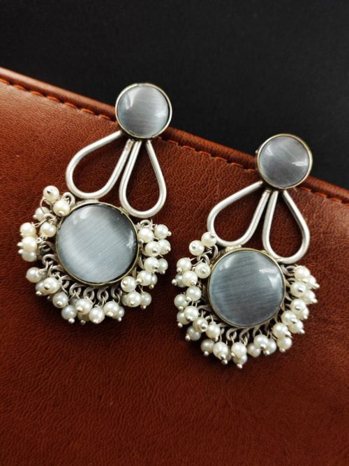 Hand-made silver earrings featuring a stone resembling the Monalisa Stone