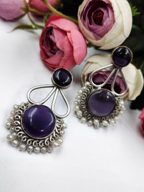 Hand-made silver earrings featuring a stone resembling the Monalisa Stone