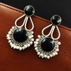 Hand-made silver earrings featuring a stone resembling the Monalisa Stone