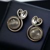 Elegant Designer Stud Earrings in Silver Replica with Monalisa Stone, featuring intricate craftsmanship and a timeless appeal.