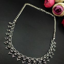 Oxidised choker necklace with intricate floral motifs and silver plating.