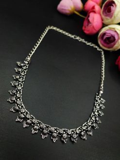Oxidised choker necklace with intricate floral motifs and silver plating.