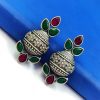 Silver flower pot earrings inspired by Kalash culture, crafted with intricate silver detailing.