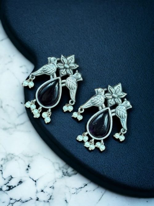 Affordable silver-look oxidized stud earrings featuring a bird-inspired design with premium stones for a sophisticated yet budget-friendly look