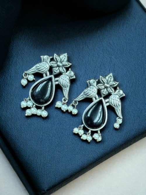 Affordable silver-look oxidized stud earrings featuring a bird-inspired design with premium stones for a sophisticated yet budget-friendly look