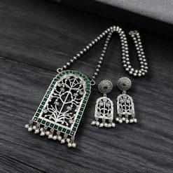 Antique Floral Art Pendant Set featuring a silver replica necklace with intricate floral design and matching earrings.
