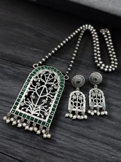 Antique Floral Art Pendant Set featuring a silver replica necklace with intricate floral design and matching earrings.