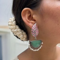 Handmade Painting Earrings with intricate hand-painted designs and silver replica oxidized finish featuring stone embellishments.