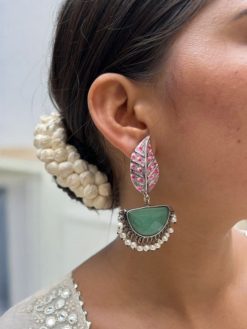 Handmade Painting Earrings with intricate hand-painted designs and silver replica oxidized finish featuring stone embellishments.
