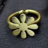 Gold-plated adjustable flower design ring made from premium brass metal.