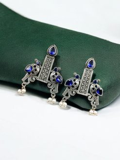 Graceful bird stud earrings in silver replica with intricate stone work, lightweight and elegant.