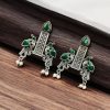 Graceful bird stud earrings in silver replica with intricate stone work, lightweight and elegant.