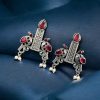 Graceful bird stud earrings in silver replica with intricate stone work, lightweight and elegant.