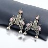 Graceful bird stud earrings in silver replica with intricate stone work, lightweight and elegant.
