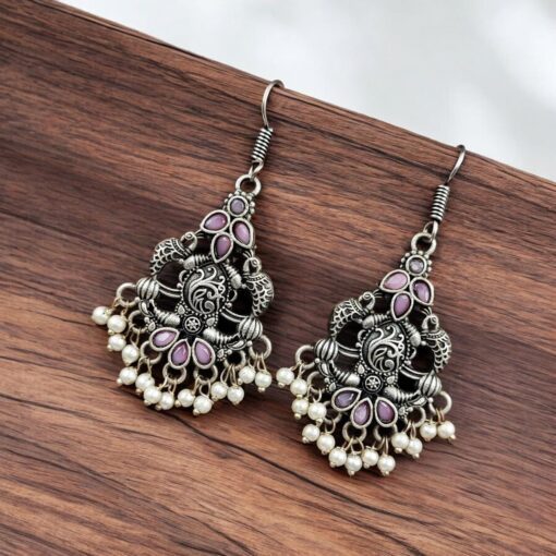 Brass peacock hanging earrings with stone accents, featuring intricate detailing and a vibrant, elegant design