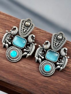 Silver replica earrings with Monalisa Stone Earrings and a beautiful brass peacock stud design, perfect for elegant and versatile wear