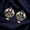 Antique-style silver replica bird stud earrings in brass with intricate vintage design, perfect for traditional and modern outfits