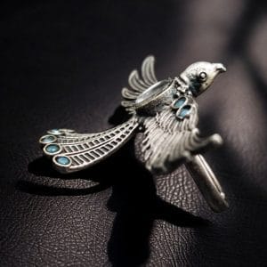 Brass bird ring with sparkling stones, featuring an elegant and intricate design perfect for any occasion.